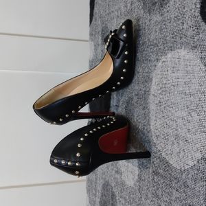 Black studded red bottom Jojo Cat shoes size 38.